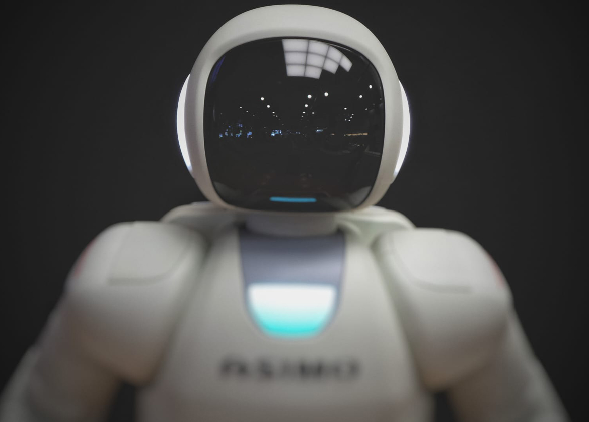 A robot with reflections in its face. The Future of Voice Assistants in Home Care.